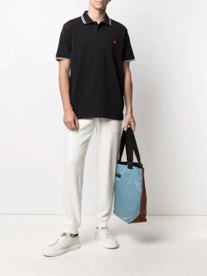 Farfetch's Post | Wearing: Peuterey Embroidered Logo Polo Shirt In Dark Blue; Brunello Cucinelli Jersey Sweatpants In White; Marni Two-tone Tote Bag In Brown