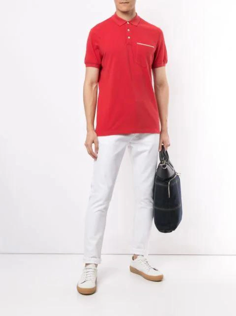 Farfetch's Post | Wearing: Brunello Cucinelli Short-sleeved Polo Shirt In Red; Ksubi Wolf-gang Stark Jeans In White; Ami Alexandre Mattiussi Low Top Trainers In White