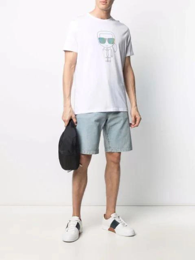 Farfetch's Post | Wearing: Karl Lagerfeld Ikonik Metallic Sheen T-shirt In White; Wardrobe.nyc X Levi's Release 04 Denim Shorts In Blue; A-cold-wall* Logo Patch Belt Bag In Black
