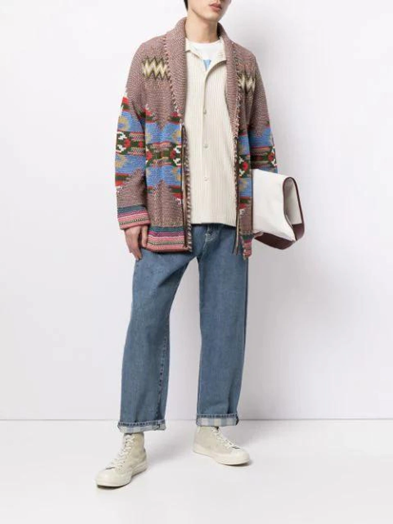 Farfetch's Post | Wearing: Sunnei Cropped Straight-leg Jeans In Washeddenim; Coohem Navajo Jacquard Knit Cardigan In Red; Issey Miyake Technical-pleated Short-sleeved Shirt In White
