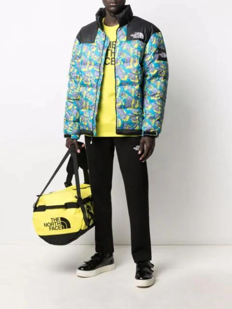 Farfetch's Post | Wearing: The North Face T-shirt In Cotton With Print In Green; The North Face Base Camp Duffle In Yellow; Eytys Black Doja Velcro Leather Sneakers