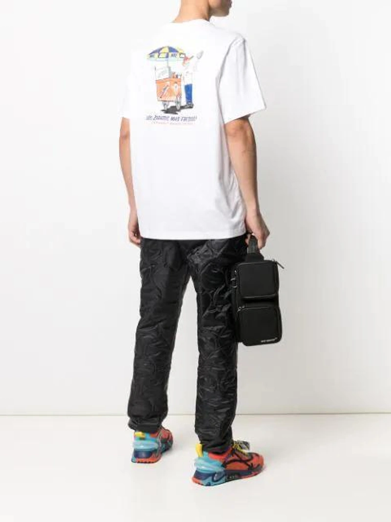 Farfetch's Post | Wearing: Nike Sole Food Graphic Print T-shirt In White; Nike Heritage Insulated Trousers In Black; Off-white Cordura Logo Print Belt Bag In Black