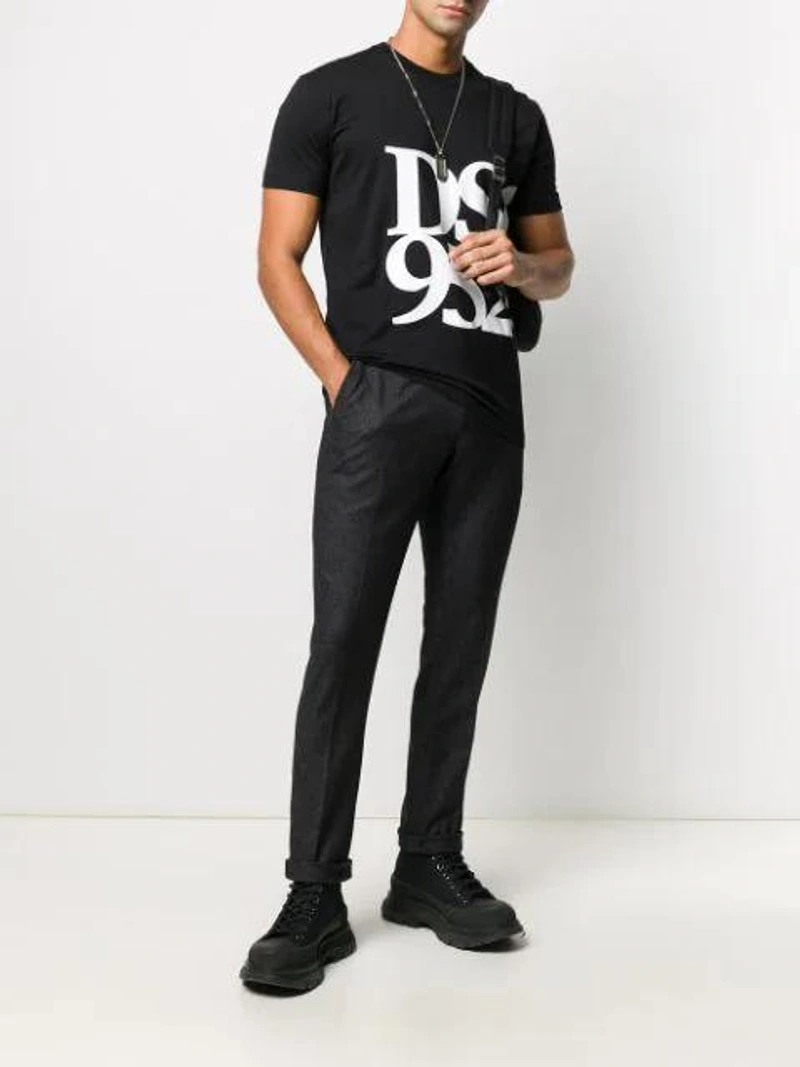 Farfetch's Post | Wearing: Alexander Mcqueen Chunky High-top Sneakers In Black; Dsquared2 Graphic Print T-shirt In Black; Dondup Slim-fit Tailored Trousers In Black