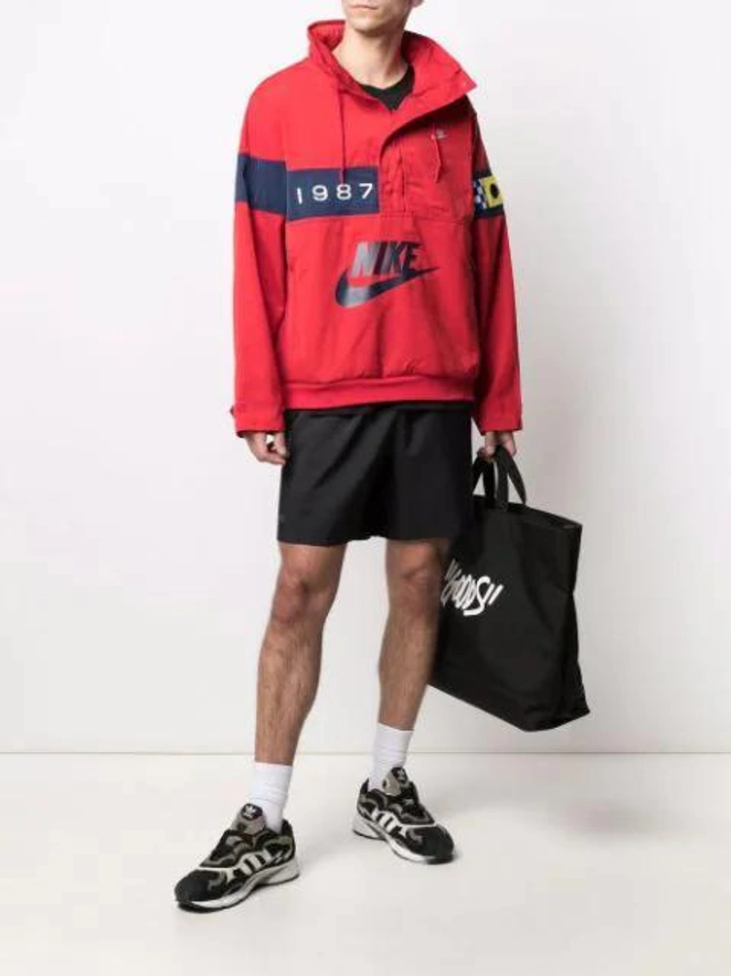 Farfetch's Post | Wearing: Nike Logo-embellished Pullover Jacket In Red; Adidas Originals Lightweight Logo-print T-shirt In Black; Adidas Originals Adidas X Neighborhood Track Shorts In Black