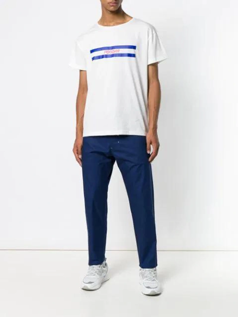 Farfetch's Post | Wearing: Biro Sports Short Sleeve T-shirt In White; Alexander Mcqueen Skull Knitted Socks; Biro Workout Trousers In Blue