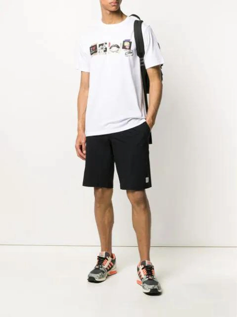 Farfetch's Post | Wearing: Paul Smith Logo Patch Track Shorts In Black; Prada Brand-plaque Zipped Nylon Backpack In Black