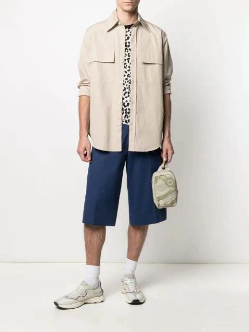 Farfetch's Post | Wearing: Kenzo Blue Gabardine Casual Shorts; Kenzo Leopard-print Short-sleeve T-shirt In Black; Maison Margiela Silver Engraved Cuff Bracelet