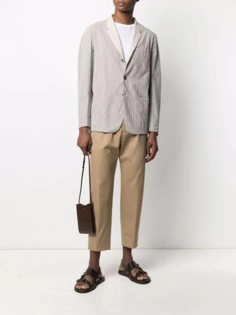 Farfetch's Post | Wearing: Sease Striped Single-breasted Blazer In Neutrals; Jil Sander Straight-leg Cropped Trousers In Neutrals; Joseph Soft Organic Jersey T Shirt In Blue Steel