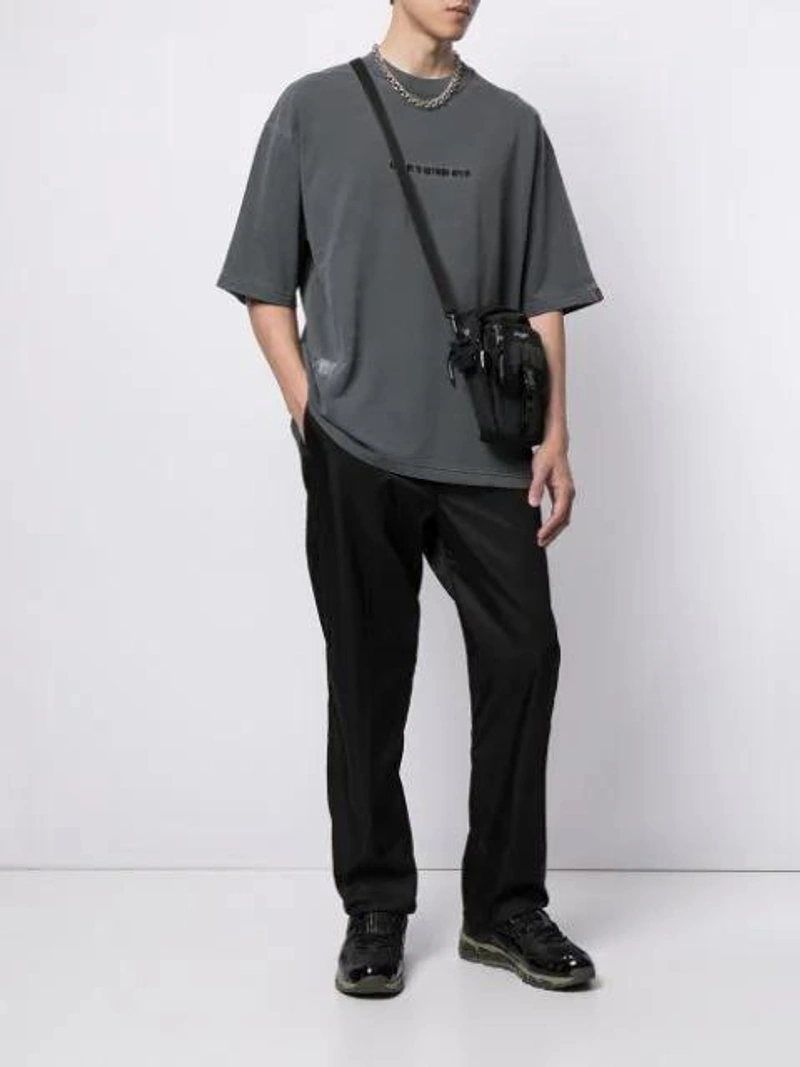 Farfetch's Post | Wearing: Aape By A Bathing Ape Embroidered Logo T-shirt In Grey; Prada Nylon Logo Badge Trousers - Black; Indispensable Black Buddy Aurora Shoulder Bag