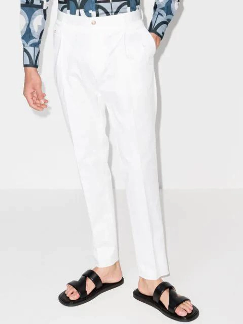 Farfetch's Post | Wearing: Dolce & Gabbana Pleated Front Chinos In White; Bottega Veneta Black Leather Slip-on Sandals