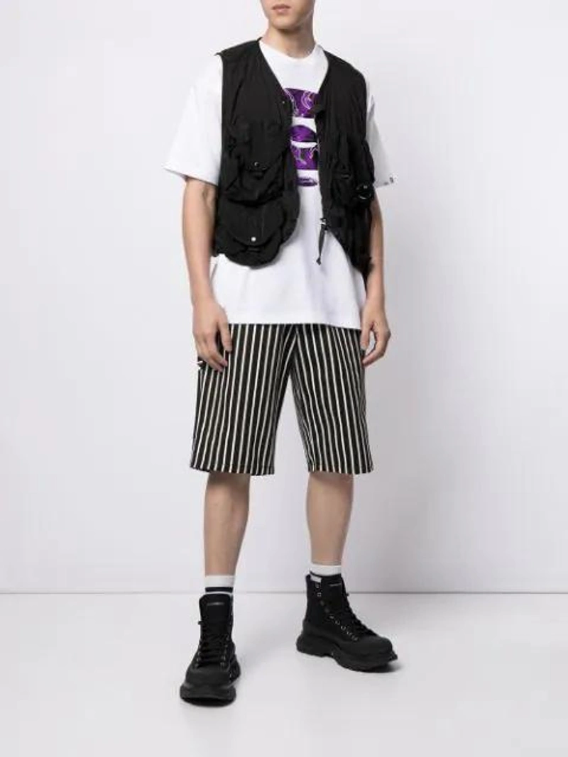 Farfetch's Post | Wearing: Alexander Mcqueen Tread Slick High-top Sneakers In Black; Aape By A Bathing Ape Graphic-print Short-sleeved T-shirt In White; Ami Alexandre Mattiussi Worker Short In Noir/blanc 004