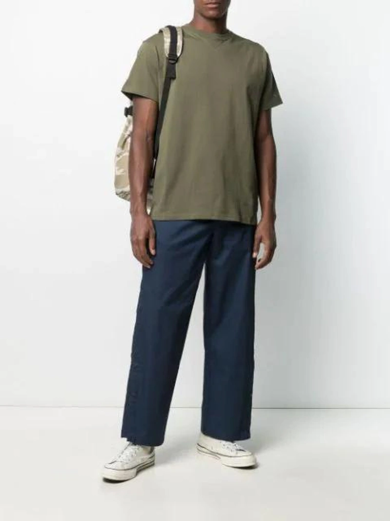 Farfetch's Post | Wearing: Converse Navy Kim Jones Edition Twill Cargo Pants In Black Iris; Carhartt Payton Backpack In Green