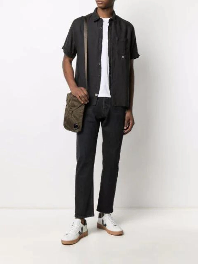 Farfetch's Post | Wearing: Prada Logo-print Short-sleeved T-shirt In White; Emanuele Bicocchi Curb Braided Bracelet In Silver; C.p. Company Short-sleeve Linen Shirt In Black