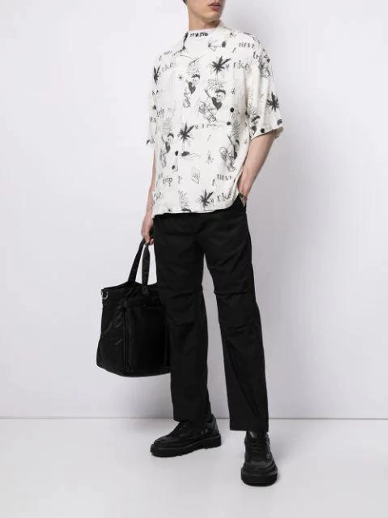 Farfetch's Post | Wearing: Five Cm Graffiti Print Shirt In White; Wacko Maria X Porter 12 Record Tote Bag In Black; Tom Wood Sterling Silver Box Chain-link Necklace