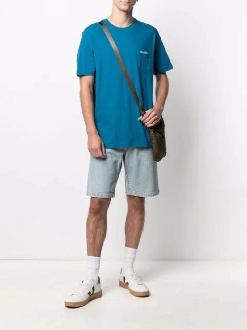 Farfetch's Post | Wearing: C.p. Company Short-sleeved Logo Pocket T-shirt In Blue; Wardrobe.nyc X Levi's Release 04 Denim Shorts In Blue; C.p. Company Green Nylon Messenger Bag