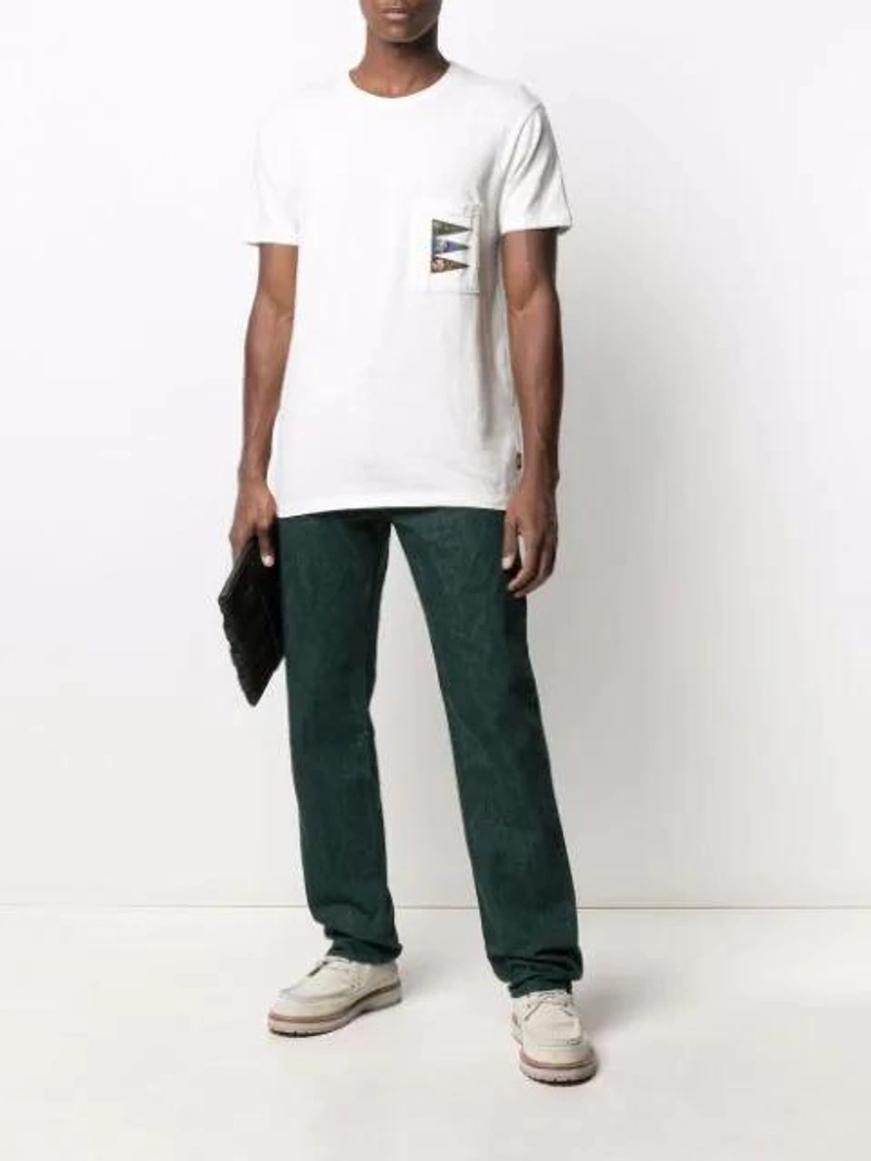 Farfetch's Post | Wearing: Kapital Out Of The Box Jeans In Green; Kapital Patch-pocket Cotton T-shirt In White; Mismo Woven Clutch Bag In Black