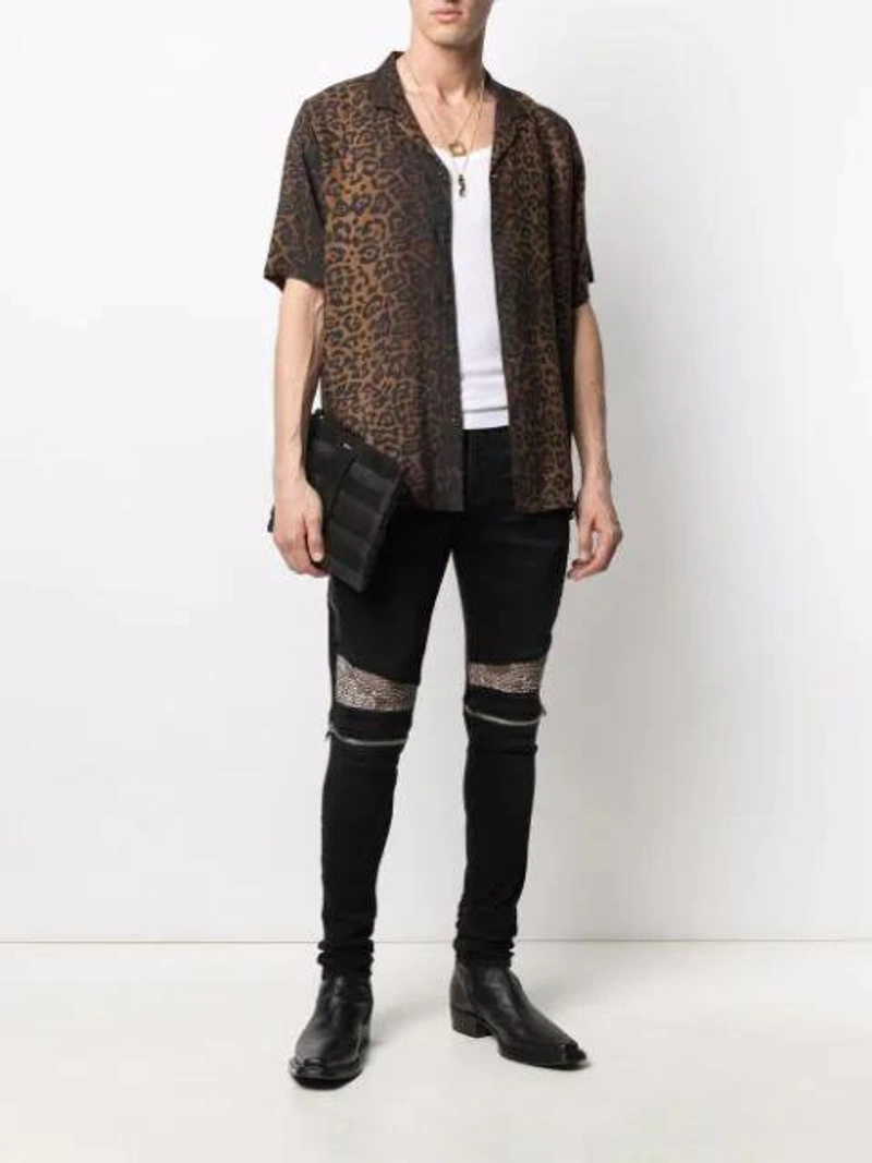 Farfetch's Post | Wearing: Amiri Printed-panel Biker Jeans In Black; Schiesser Friedrich Cotton Tank Top In White; Ksubi Men's Prowler Leopard-print Camp Shirt In Brown