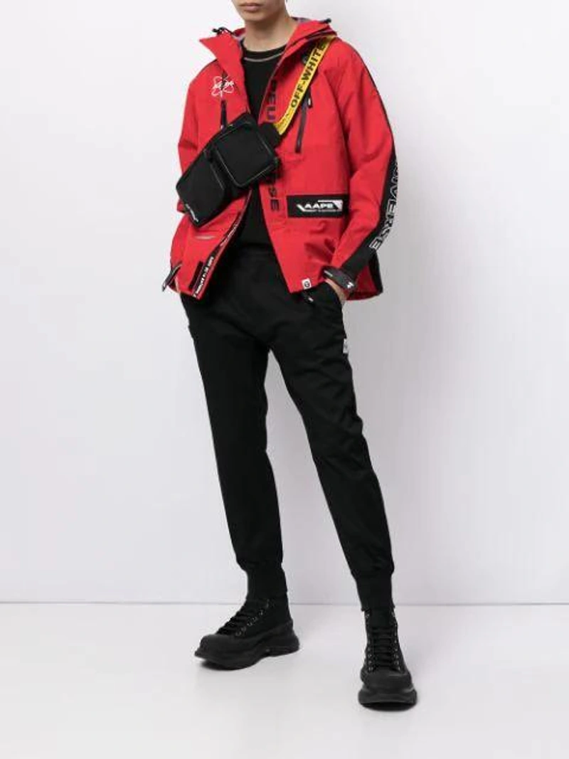 Farfetch's Post | Wearing: Canada Goose Red Arctic Disc Beanie; Alexander Mcqueen Chunky High-top Sneakers In Black; Aape By A Bathing Ape Logo-patch Slim Joggers In Black