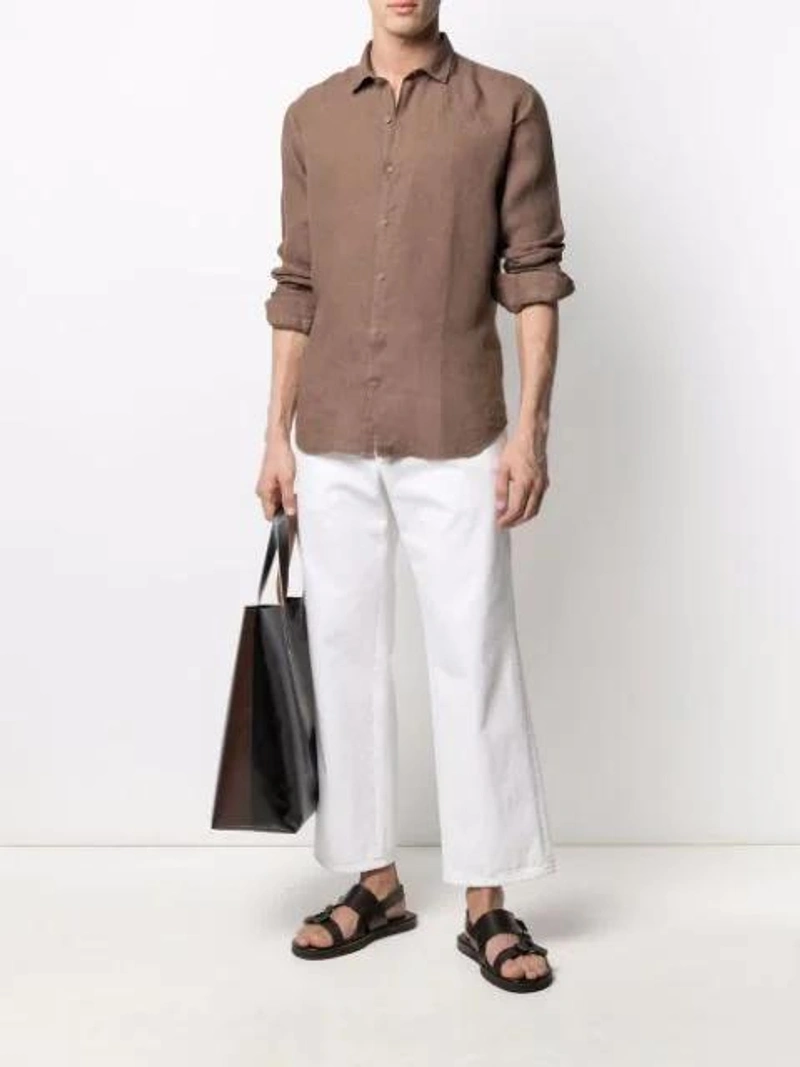 Farfetch's Post | Wearing: Costumein Long-sleeved Linen Shirt In Brown; Prada Cropped Straight-leg Jeans In White; Apc Logo-print Leather Messenger Bag In Brown