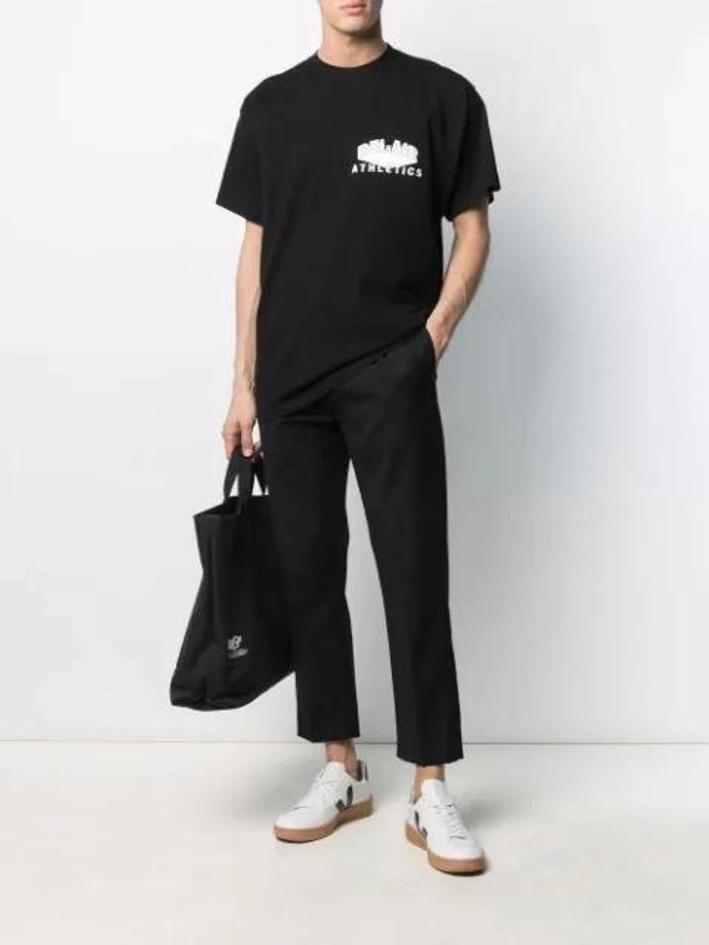 Farfetch's Post | Wearing: G.h. Bass & Co. Black Weejuns Larkin Tassel Loafers; Bel-air Athletics Logo-print T-shirt In Black; Cmmn Swdn Tapered Drawstring Trousers In Black