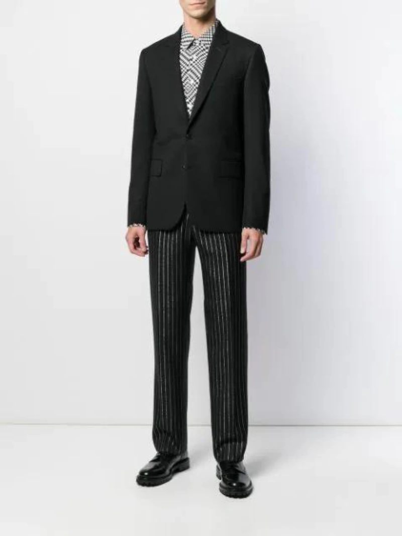 Farfetch's Post | Wearing: Common Projects Black Standard Combat Boots; Cobra Sc Model 1 Shirt In White Optic; Cobra Sc Metallic Pinstriped Wool Trousers