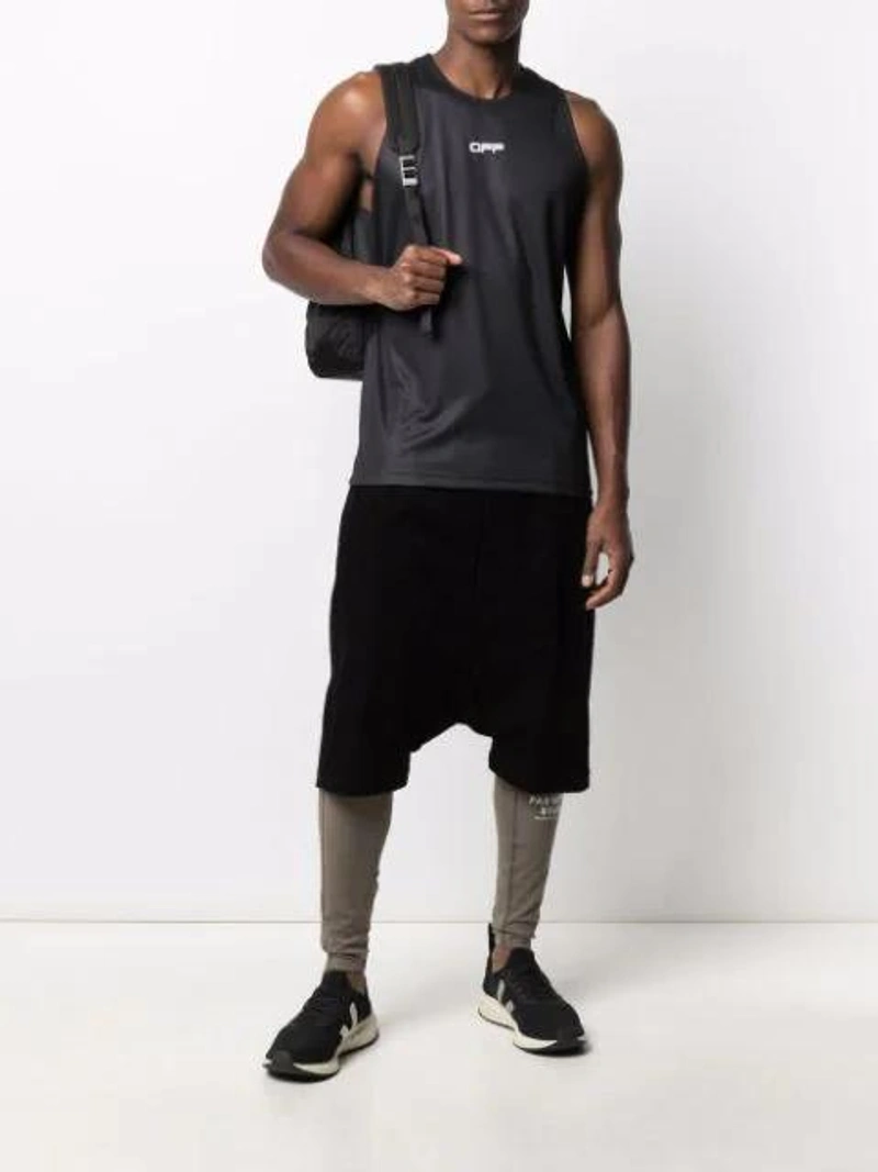 Farfetch's Post | Wearing: Off-white Logo-waistband Cycling Shorts In Black White; Pas Normal Studios Balance Logo-print Leggings In Neutrals; Rick Owens Pods Drop Crotch Corduroy Shorts In Black