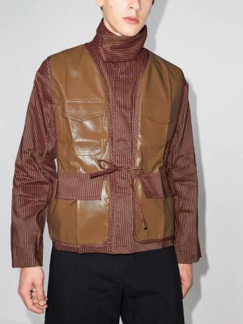Farfetch's Post | Wearing: Pronounce Contrasting-panel High-neck Jacket In Brown; Pronounce Tie-dye Long-sleeve Shirt In Orange; Pronounce Specific Pleated Cropped Trousers In Black