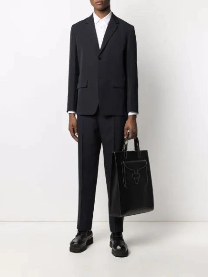 Farfetch's Post | Wearing: Jil Sander Single-breasted Suit In Blue; Comme Des Garçons Shirt Front Pocket Shirt In White; Acne Studios Square-toe Grained-leather Derby Shoes In Black