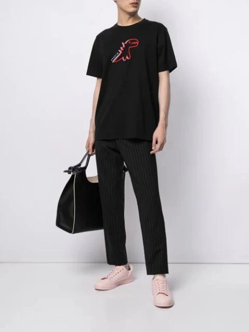 Farfetch's Post | Wearing: Sport B. By Agnès B. Hd Dino Cotton T-shirt In Black; Paul Smith Tapered Tailored Trousers In 79 Black; Marni Black Marcel Knot Leather Tote Bag In Blue