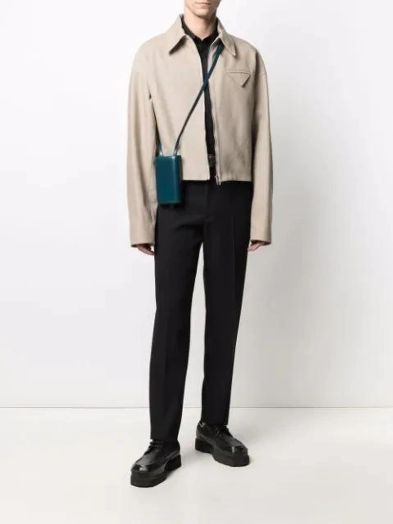 Farfetch's Post | Wearing: Fendi Contrasting-collar Long-sleeve Shirt In Black; Orciani Buckle Belt In Brown; Lemaire Molded Leather Phone Holder In Blue