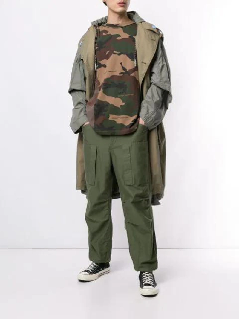 Farfetch's Post | Wearing: Converse 1970s Chuck Taylor All Star Canvas High-top Sneakers In Black; Miharayasuhiro Two-tone Hooded Trench Coat In Grey; Off-white Panelled Camouflage Cotton T-shirt In Green