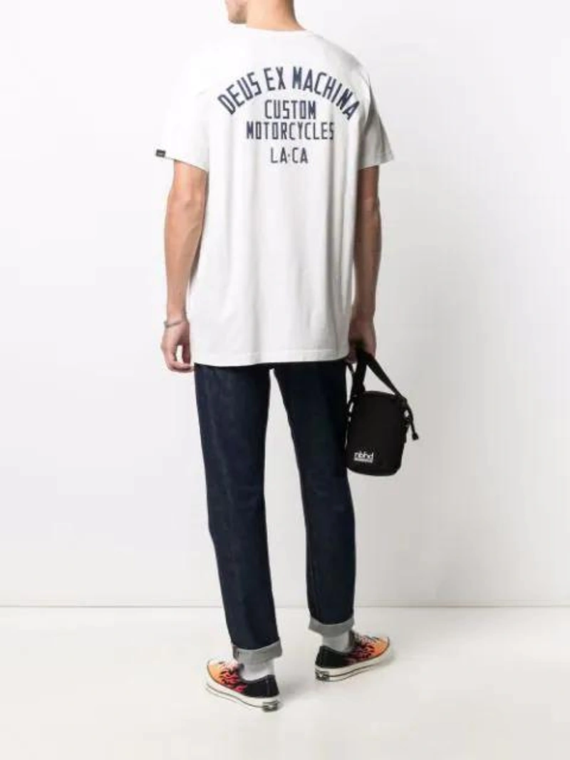 Farfetch's Post | Wearing: Converse Multicoloured Chuck 70 Flame Low Top Sneakers In Black; Deus Ex Machina Logo-print T-shirt In White; Orslow Blue Superslim Skinny Jeans