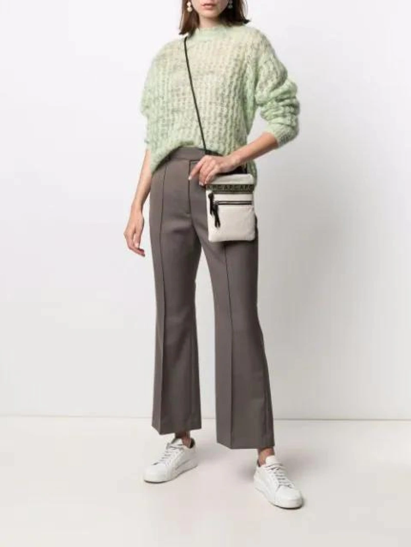 Farfetch's Post | Wearing: Acne Studios Crew Neck Sweater Mint Green; Acne Studios Flared Tailored Trousers In Brown; Apc Logo-print Crossbody Bag In White