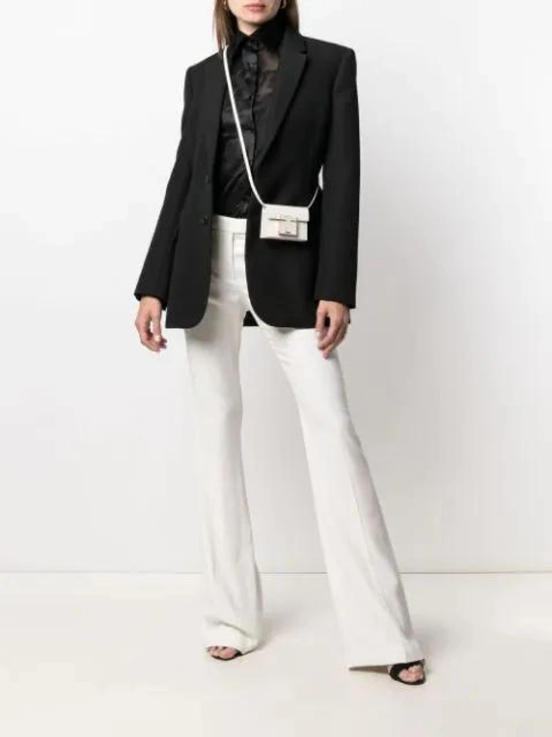 Farfetch's Post | Wearing: Alexander Mcqueen High-rise Pleated Suit Trousers In White; Ganni Heavy Satin Slip Top In Black; Tom Ford Crocodile-effect 001 Crossbody Bag In White
