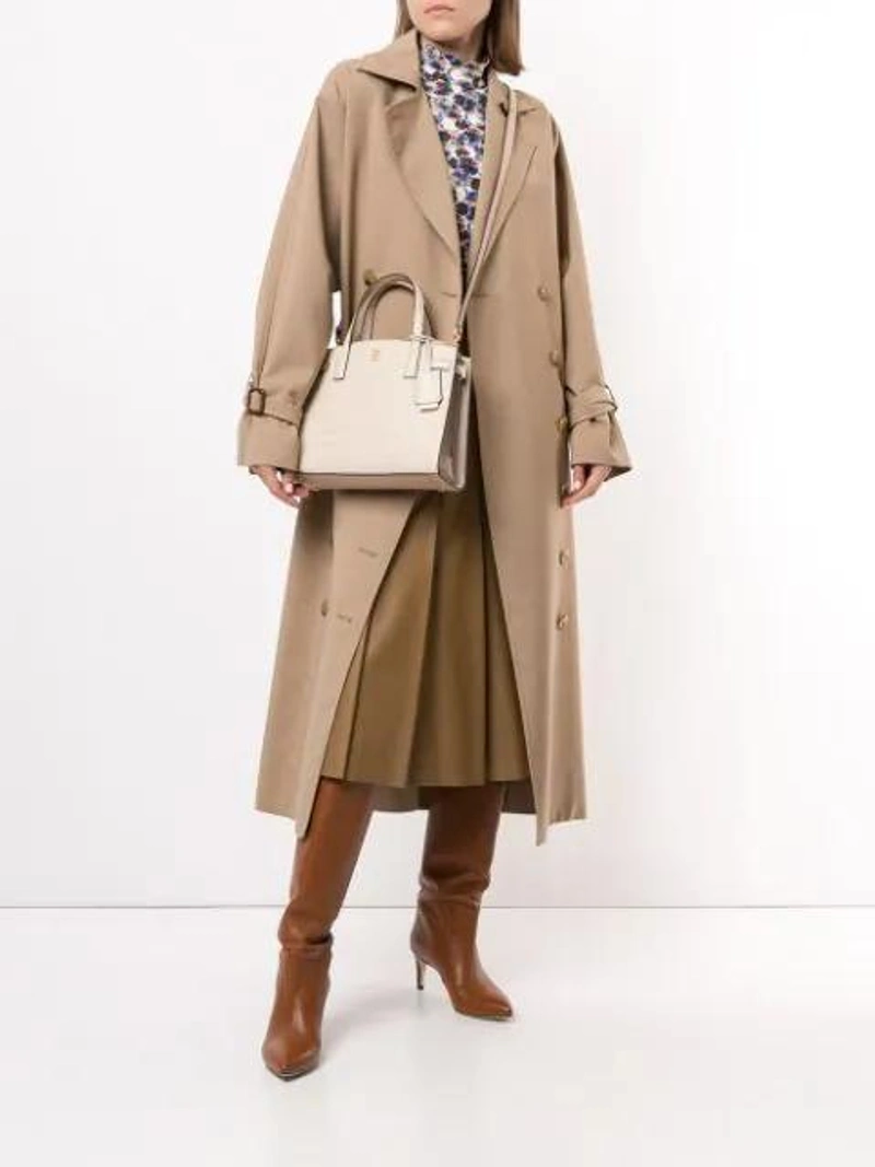 Farfetch's Post | Wearing: Marysia Blue Scalloped Sea Urchin Print Rashguard Top; Totême Double-breasted Trench Coat In Brown; Tory Burch Small Walker Shoulder Bag In Neutrals