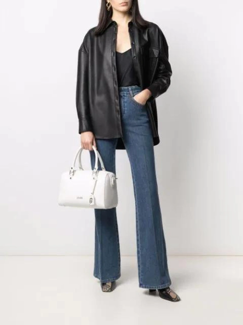 Farfetch's Post | Wearing: Ganni Heavy Satin Slip Top In Black; Tibi Oversized Button-down Shirt In Black; Chloé Printed High-rise Flared Jeans In Blue