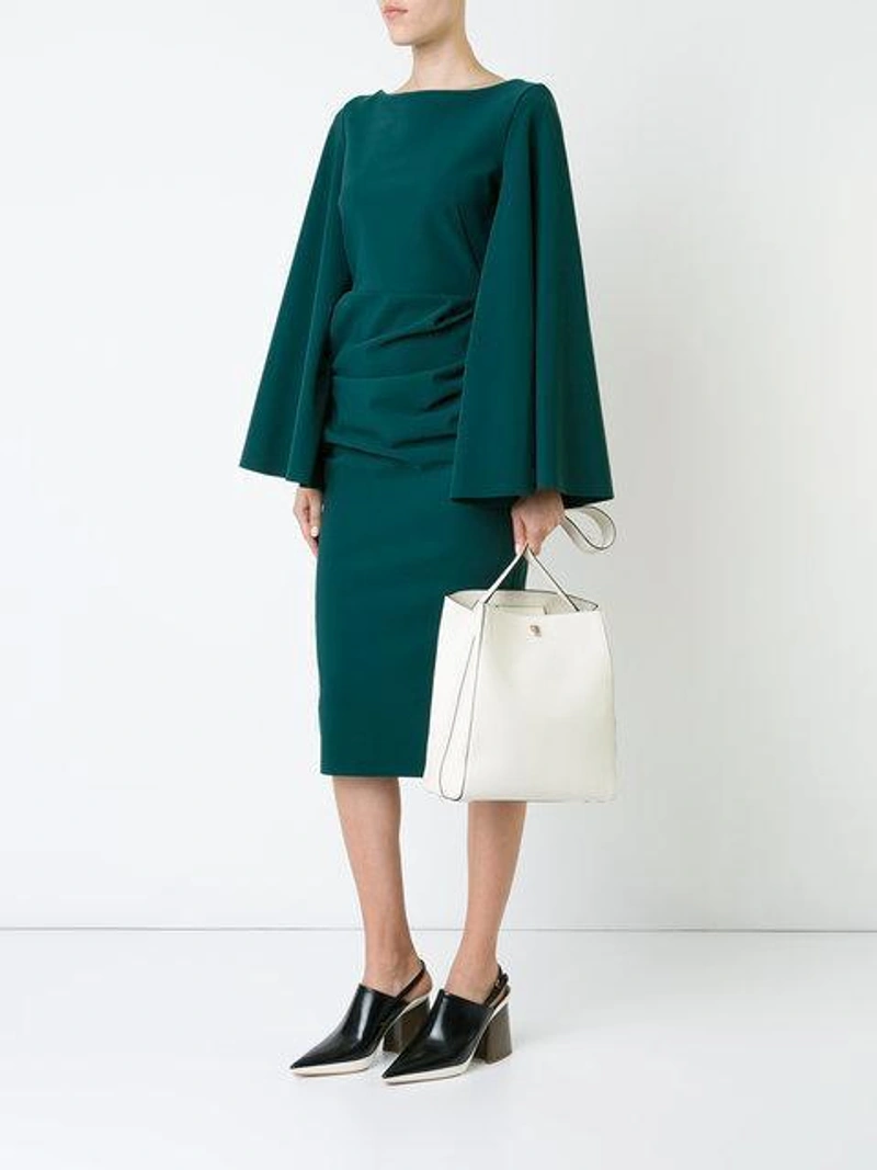 Farfetch's Post | Wearing: Valextra Boxy Structured Shoulder Bag; Marni Closed Toe Heeled Sandals