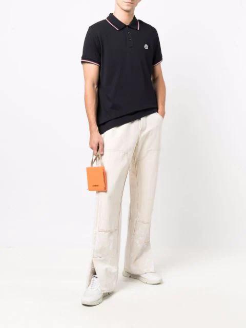 MONCLER This Polo Shirt Features A Timeless Design That Transcends The Seasons In Black