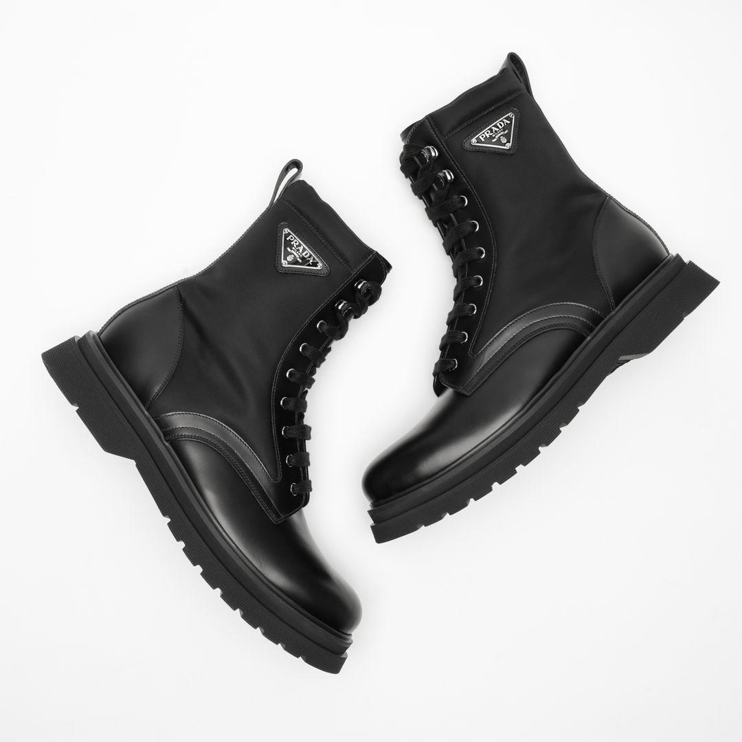 PRADA Logo-plaque Panelled Ankle Boots In Black