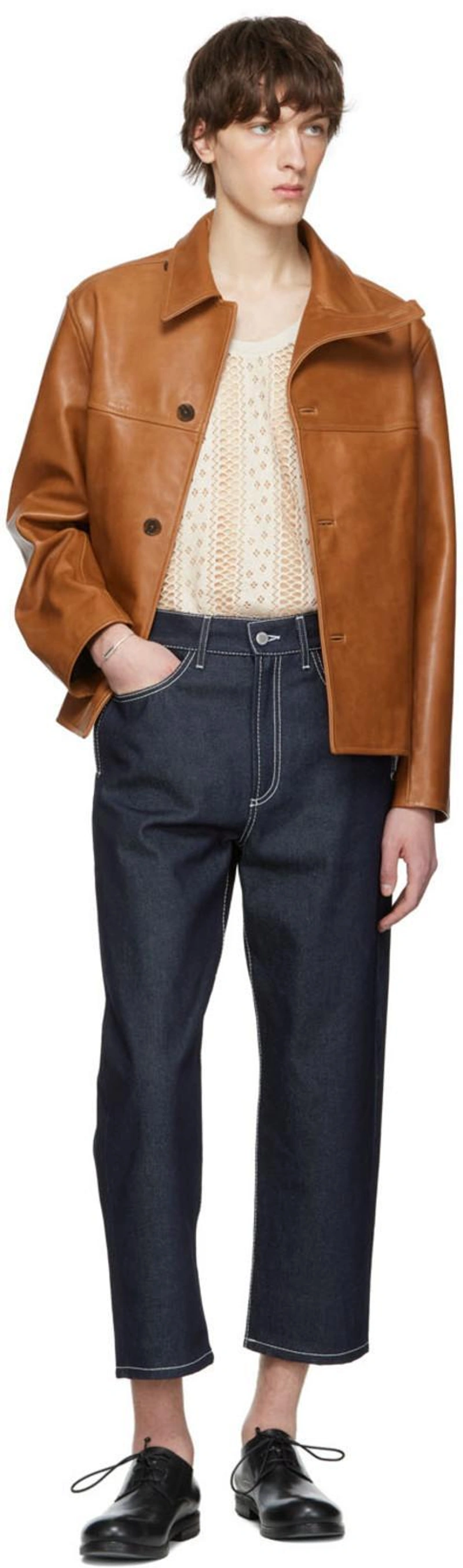 SSENSE's Post | Wearing: Sunnei Contrast-stitched Straight-leg Jeans In Denim; Commission Ssense Exclusive Brown Leather Jacket In Cognac; Cmmn Swdn Off-white Tank Tank Top