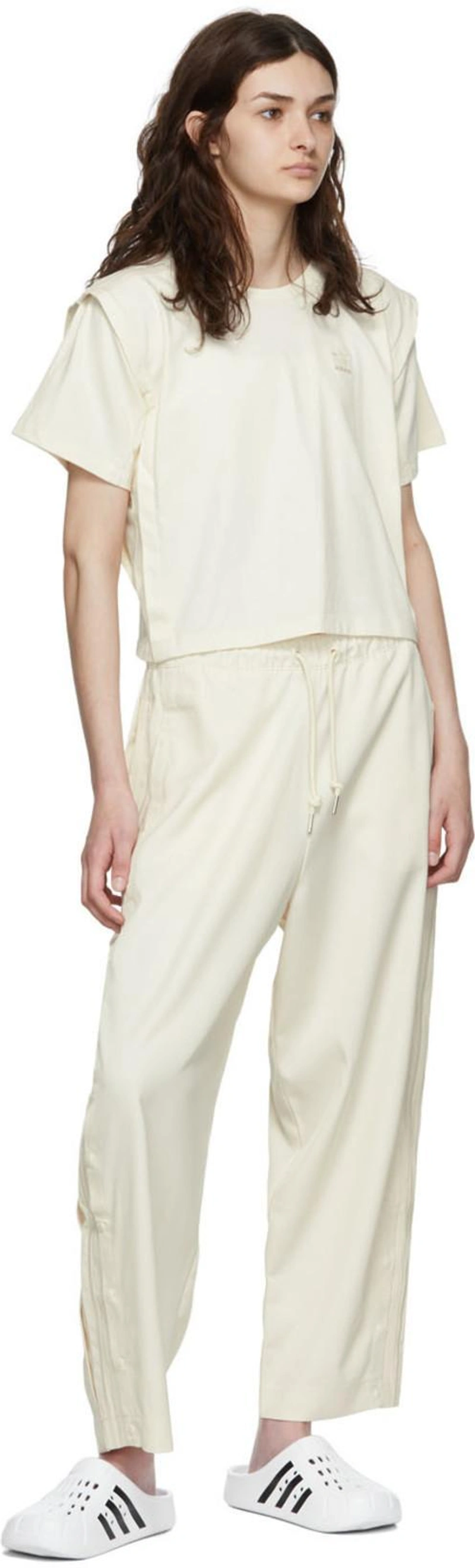 SSENSE's Post | 搭配: Adidas Originals Boxy 3-stripes Organic Cotton T-shirt In Non-dyed；Adidas Originals Off-white Recycled Polyester Lounge Pants In Wonder White；Adidas Originals White Adilette Clog Sandals In Ftwwht/cbl