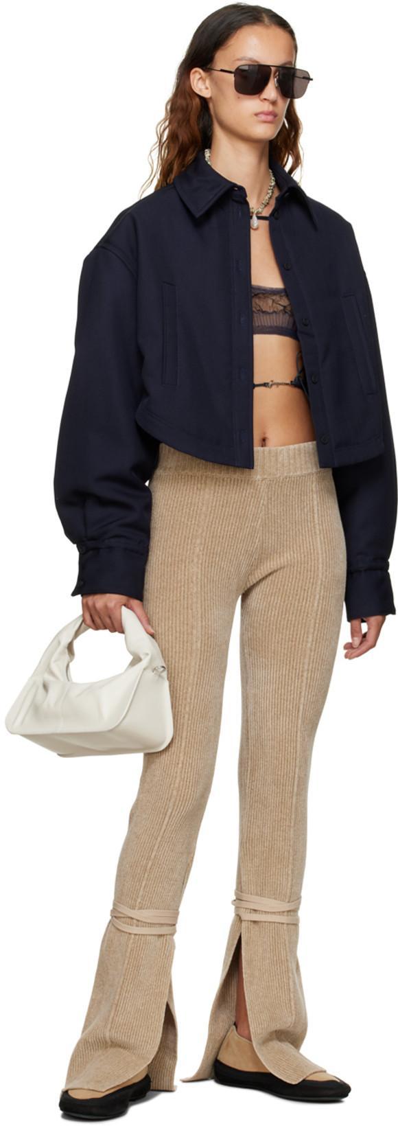 JACQUEMUS Gold Toned Logo Charm Ribbed Knit Cropped Cardigan In Black