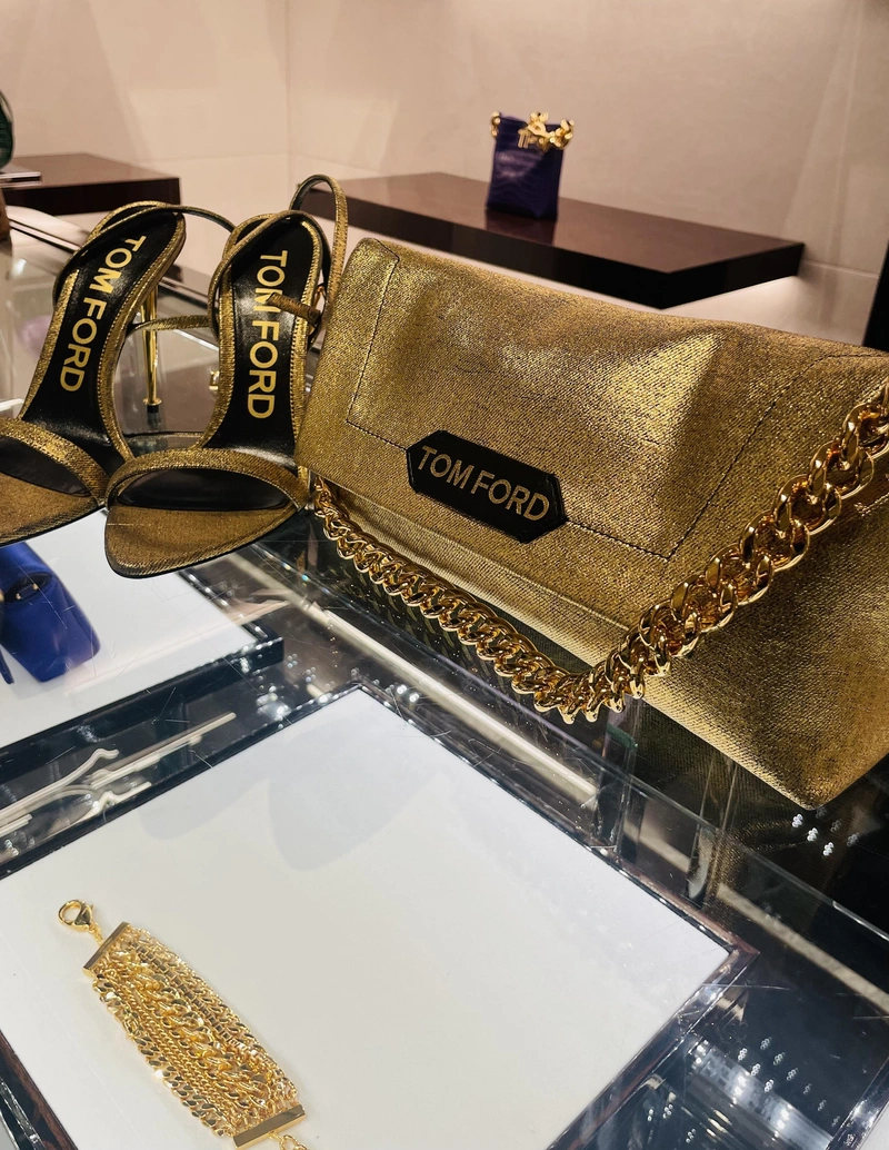 The LSY Fashion Edit: Tom Ford Gold | Wearing: Tom Ford Label Mini Lizard-print Chain Clutch Bag In Gold; Tom Ford Mini Chain Croc-embossed Top-handle Hobo Bag In Black; Tom Ford Multi-chain Bracelet In Gold