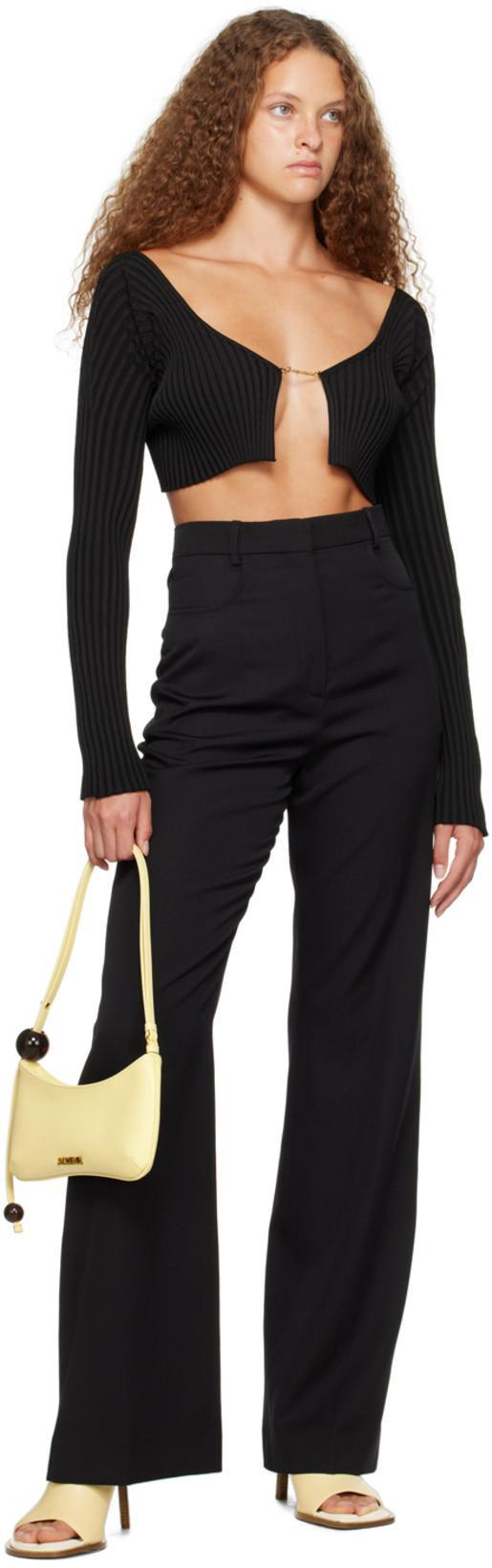 JACQUEMUS Gold Toned Logo Charm Ribbed Knit Cropped Cardigan In Black