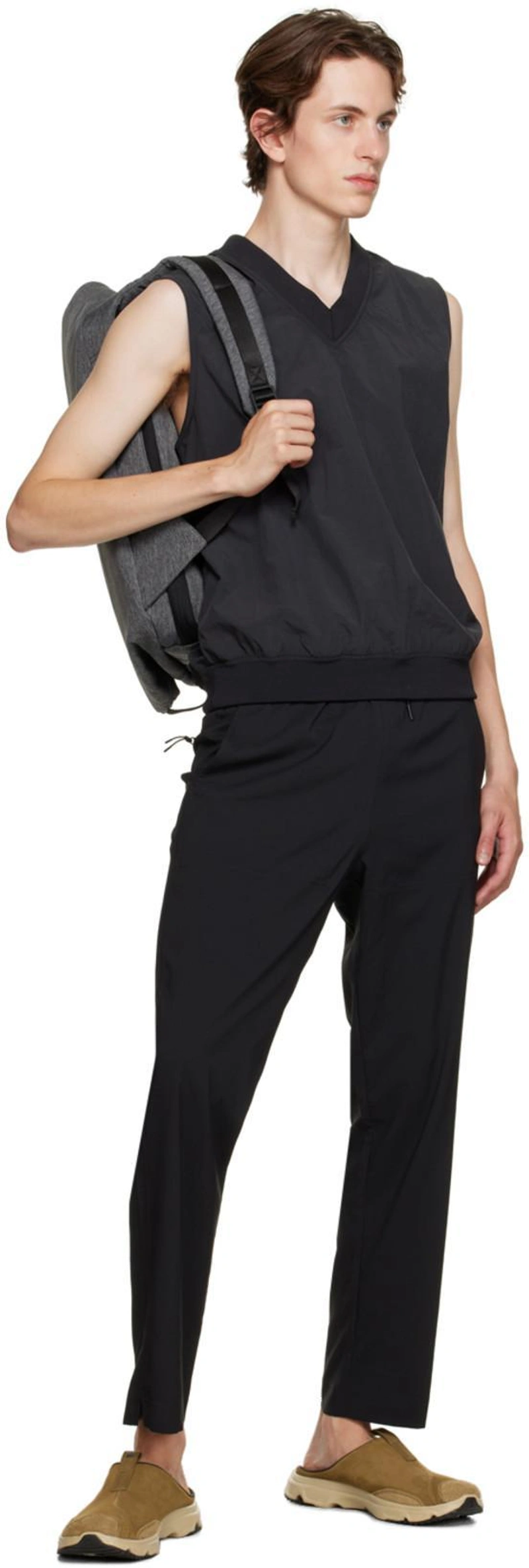 SSENSE's Post | 搭配: Outdoor Voices Solarcool Tourist Pant In Black；Outdoor Voices Black Pullover Vest；Côte And Ciel Gray Medium Isar Backpack In Black Melange