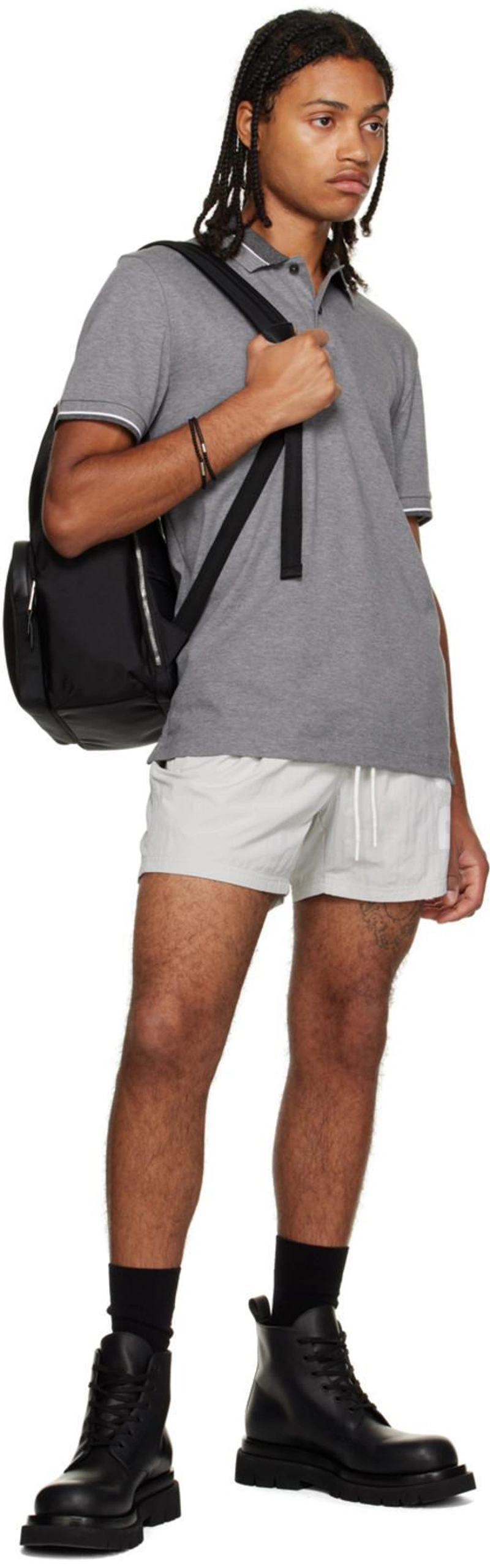 SSENSE's Post | 搭配: Hugo Boss Black Multi-pocket Backpack In Black 001；Hugo Boss Black Rubber Bracelet In Black 001；Bottega Veneta Black Lug Lace-up Boots In 1000-black