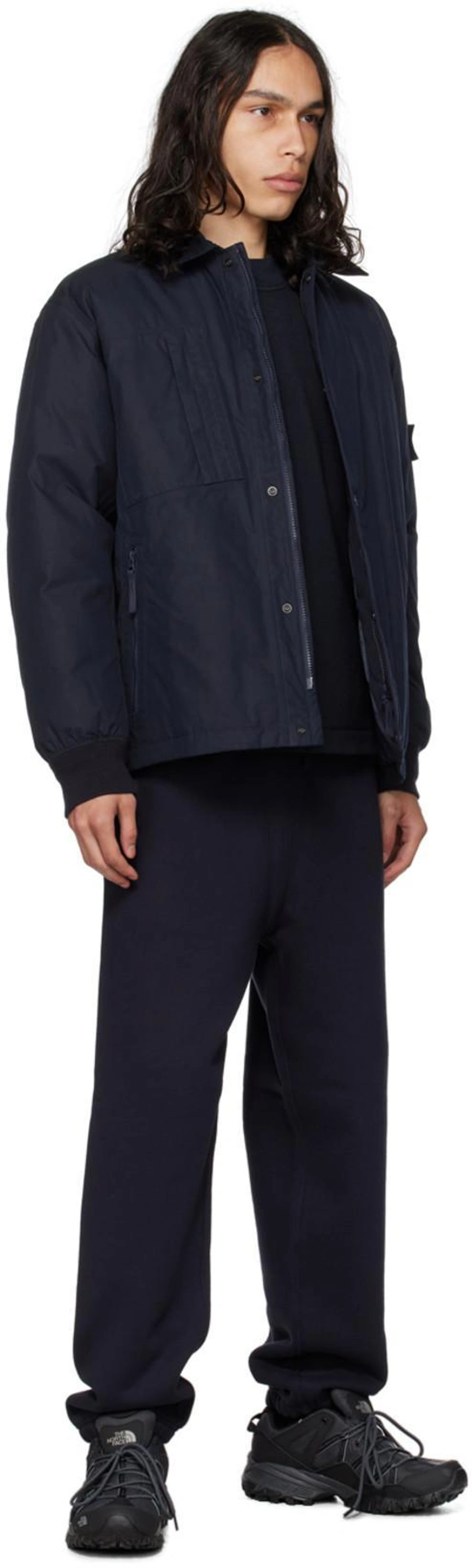 SSENSE's Post | 搭配: Stone Island Navy Ghost Down Jacket In Blue；Stone Island Navy Drawstring Sweatpants In V0020 Navy Blue；The North Face Ultra 111 Wp Sneakers In Black And Charcoal