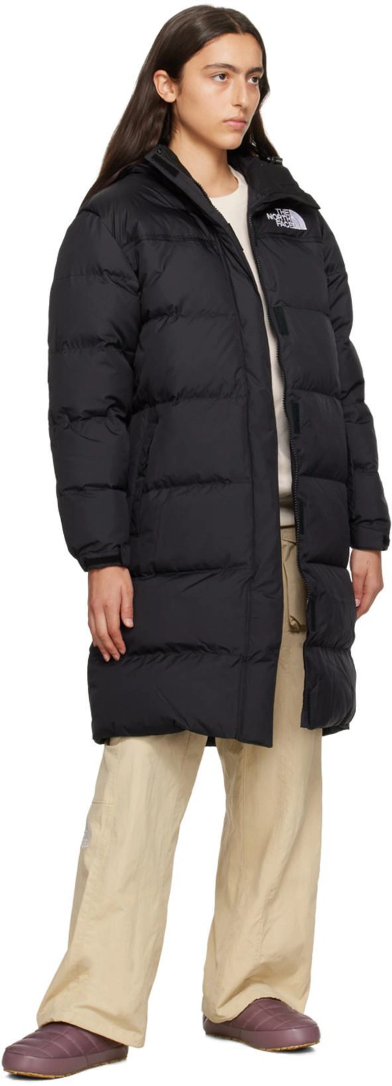 SSENSE's Post | 搭配: The North Face Nuptse 连帽绗缝大衣 In Tnf Black；The North Face White Embroidered Sweatshirt In N3n Gardenia White；The North Face Purple Thermoball Traction V Mules In Dark Crimson