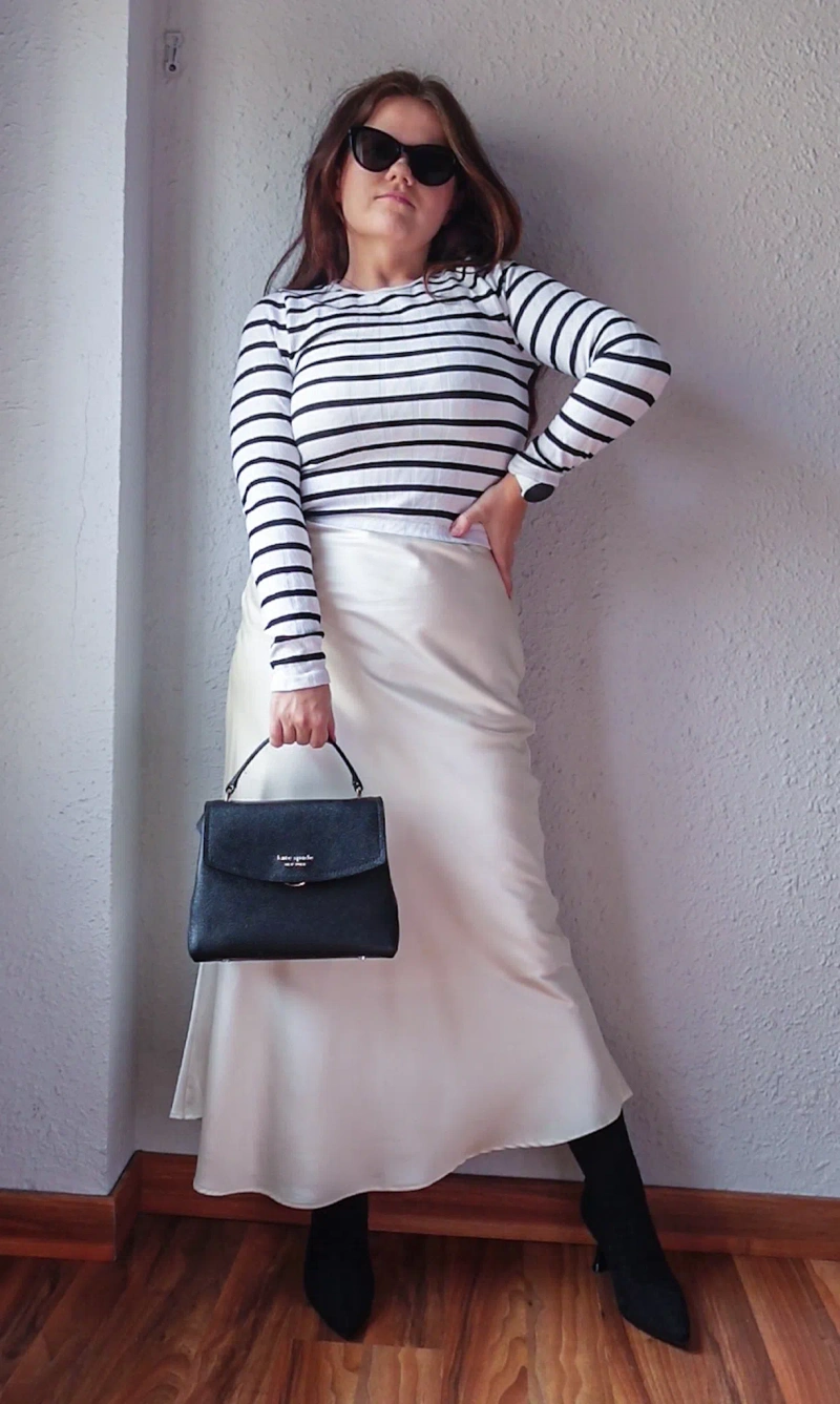Sock boot spring look | Wearing: L'agence Tess Stripe T-shirt In Black/white Stripe; Brunello Cucinelli Satin Midi Skirt In C200-marble; Ramy Brook Magdalena Satin Midi Skirt In Ivory