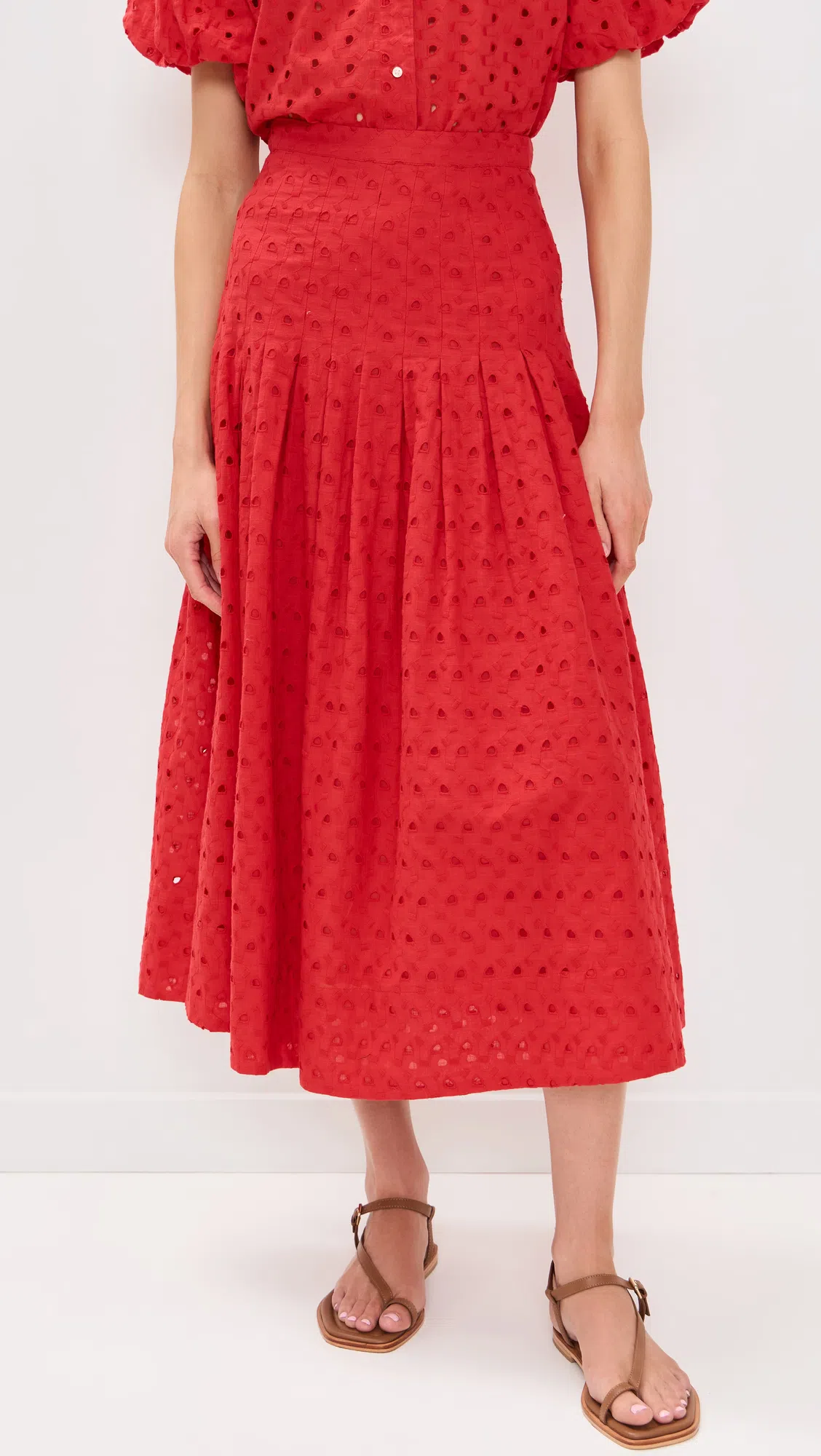 THE GREAT . The Rhythm Eyelet Midi Skirt In Red Rose
